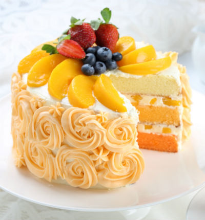 Fruit cake with peach and strawberry topping, 1 lb (1/2 kg). (substitutions may apply if item not available)