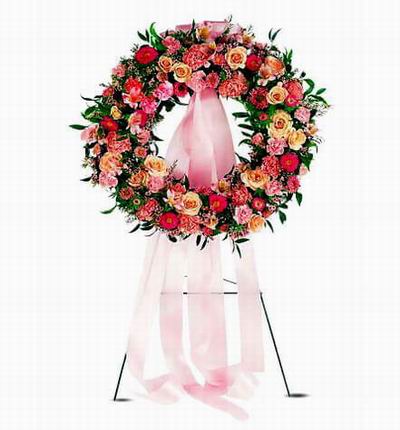 Wreath Shaped Stand with Roses, Carnations, Daisies and Greenery.