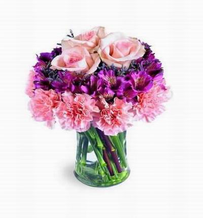 Pink carnations form the first tier; deep lavender alstroemeria fill the center, and three luscious pink roses