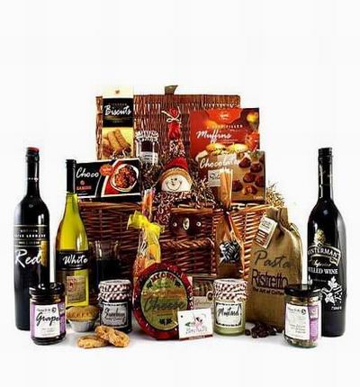2 bottles of red wine, 1 bottle of white wine, Grape jam, Strawberry jam, Mustard, Cheese, dried pasta, Chocolates, Muffins, cookies. Wine based on local wine selection. Brands will vary.  (Photo image is only an example)