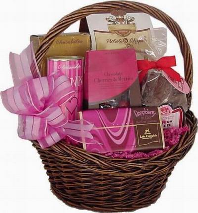 Basket with Chocolates, Potato Chips, Raspberry Chocolate bar and a bag of Cherries and Berries.