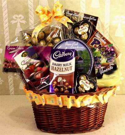 Gift Basket with Ferrero Chocolates, 24 pcs, two small Ferrero Chocolate packages of 3 pcs each, a Raisin Chocolates, Strawberry Chocolate bar, and Dairy Milk Hazelnut Chocolate bar. Also with an assorted mix of cookies, Chocolate Almonds, Chocolate Cooki