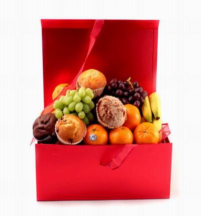Box of 4 Oranges, 4 mix of Muffins, 4 Bananas, Finger Grapes and Globe Grapes.
