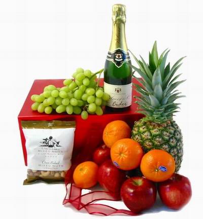 Gift box with a small bottle of Sparkling Cider, 1 Pineapple, 4 Oranges, 4 red Apples, Finger Grapes and Mixed Nuts. (A basket will be substituted if boxes are not available)