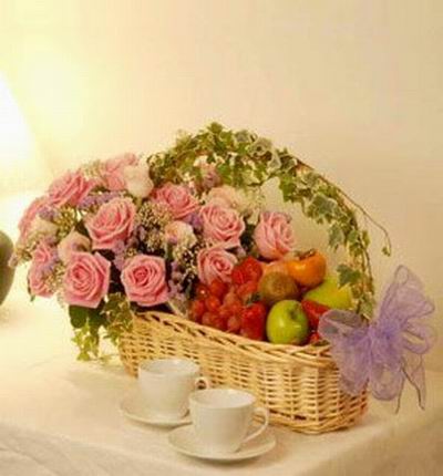 Flower basket of 12 dark pink roses, 6 light pink roses, Baby's Breath with Globe Grapes, 2 green Apples, 2 Kiwis, 1 Persimmon (substituted with a red Apple if not available).
