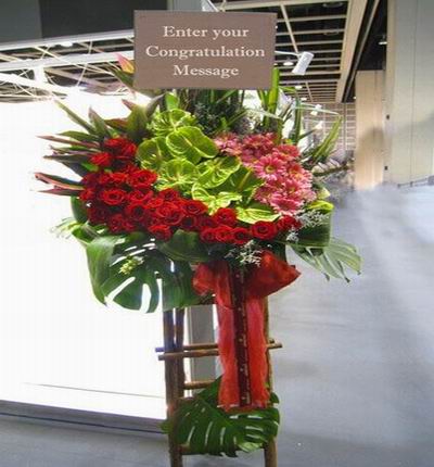 Flower Stand of Roses, Daisies and Anthuriums with large leaves (Substitutions may apply if a flower item is unavailable)