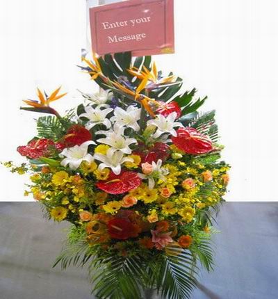 Flower Stand of Lilies, Roses, Daisies, Anthuriums and Birds of Paradise flowers with large leaves (Substitutions may apply if a flower item is unavailable)