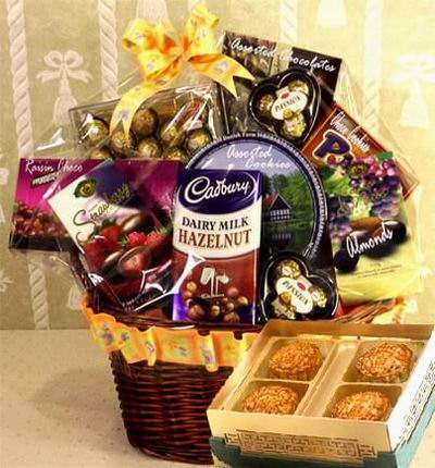 A box of Standard Mooncakes and a Gift Basket with Ferrero Chocolates, 24 pcs, two small Ferrero Chocolate packages of 3 pcs each, a Raisin Chocolates, Strawberry Chocolate bar, and Dairy Milk Hazelnut Chocolate bar. Also with an assorted mix of cookies, 
