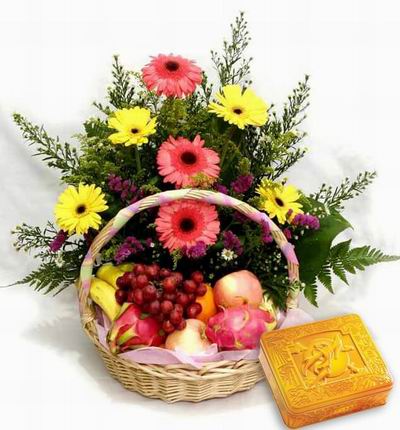 A box of Premium Mooncakes and a Flower basket of 3 pink and 4 yellow Gerebera Dasies, stock and Greenery fillers with 2 Dragon Fruits, 2 red Apples, 1 Orange, 3 Bananas and Grapes.