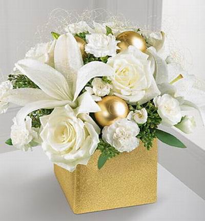 3 Roses, 2 Asiatic lilies and 10 miniature carnations, 3 Golden Ball Decoration,with seeded eucalyptus in gold box.