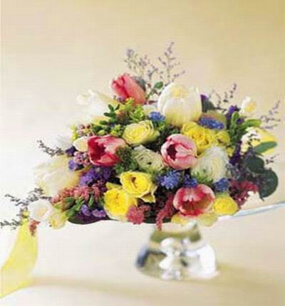 1 white Tulips, 4 pink Tulips, 3 white Roses, 6 yellow Roses, purple Statice mix display