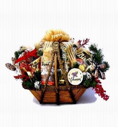 Basket of Bread, Biscuits, Crackers, Cheese, Toffee surrounded by Christmas Leaves and fillers.