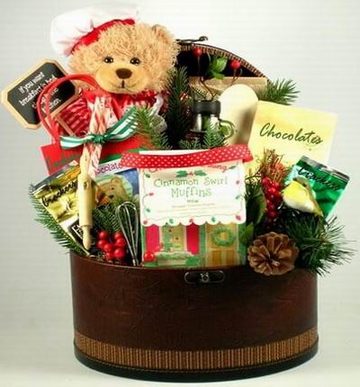 A 20cm Teddy Bear with Cinnamon Muffins, Bottle of Apple Juice, Assorted Cookies, Chocolates and Crackers.