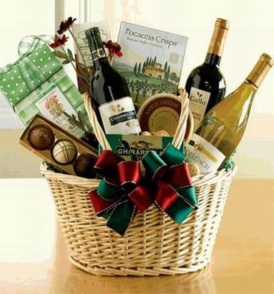 A basket of 2 red Wines, 1 bottle of white Wine, Ghirardelli Square Chocolate Bar, Assorted Chocolates, Biscuit Crisps and Crackers.