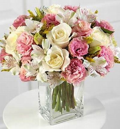 5 champagne/peach color roses, 10 pink eustomas, 9 white alstromerias in square vase (vase included)