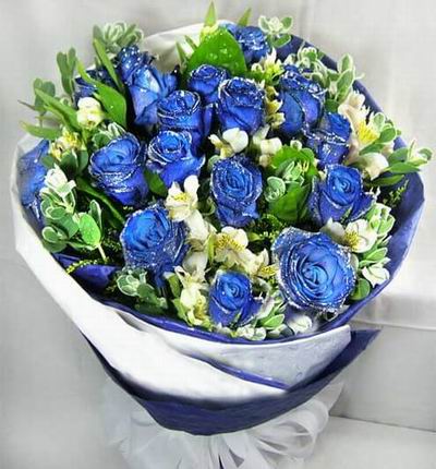 12 blue Roses with greenery.