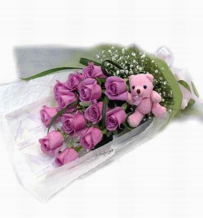 13 purple Roses with 10cm mini teddy bear with Baby's Breath fillers.