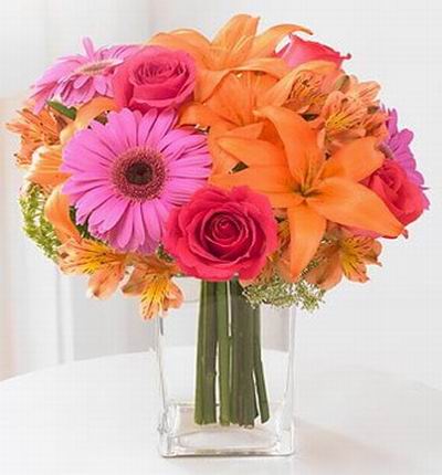 4 Lilies, 4 pink Roses, 3 pink Gerberas Daisies with 8 Alstromeria fillers.