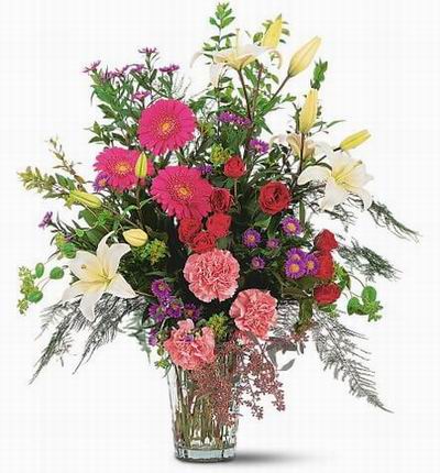 Assorted mix of Lilies, Carnations, Daisies, Roses, and fillers.
