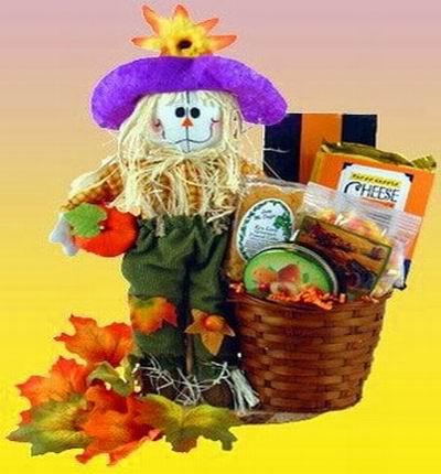 A scarecrow and bucket of cheese and crackers