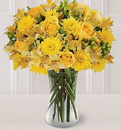 6 yellow Roses, 8 Chysanthemums and 12 Astromeria fillers.