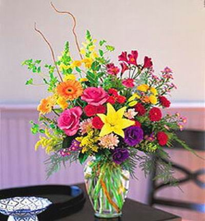 Premium multi colored floral mix including Lilies, Roses, Daisies and Carnations