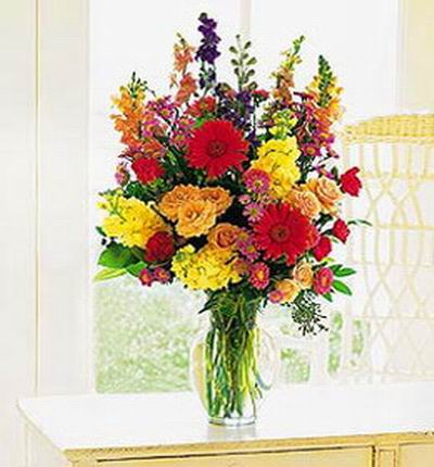 Premium multi colored floral mix including Daisies, Carnations and Roses