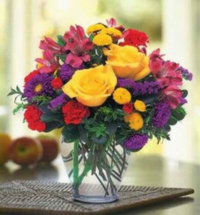 Premium strong color mix including 2 yellow Roses, Alstromerias, Carnations and fillers