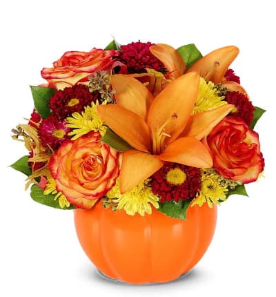 * Orange Roses
* Orange Lilies
* Red Matsumoto Asters
* Yellow Poms
* Pumpkin Ceramic Container