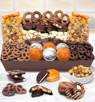 Celebrate Fall with a tray full of chocolate covered goodies! Your recipient will be happy for days munching on all the chocolate covered pretzels, cookies and more!
Includes:
* 6 OREO  Cookies Covered in Belgian Milk Chocolate
* ~4 oz. of Belgian Milk Chocolate Covered Mini Pretzels
* ~4 oz. of Belgian Dark Chocolate Covered Mini Pretzels
* 8 Large Pretzel Twists covered in Milk and Dark Belgian Chocolate
* ~3 oz. Belgian Dark Chocolate Almond Bark
* ~3 oz. Belgian White Chocolate Pistachio Bark
* ~5 oz. Caramel Popcorn drizzled with Belgian Milk Chocolate
* ~5 oz. Caramel Popcorn drizzled with Belgian Dark Chocolate
* 8 Caramel and Cashew Nut Clusters
* Tray Container

ALLERGEN ALERT: Product contains egg, milk, soy, wheat, peanuts, tree nuts and coconut. We recommend that those with food related allergies take the necessary precautions.

