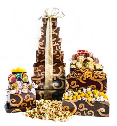 Enjoy 7 tiers of delicious gourmet snacks in this gift that is overflowing with sweet and savory treats. The impressive display will surely impress the recipient and make them excited for days.

Includes:
* Gourmet Popcorn
* Biscoff Biscuits
* Caramels
* Chocolate Chip Cookies
* Sliced Candied Fruits
* And More!
* Packaged in Decorative Brown & Gold Boxes